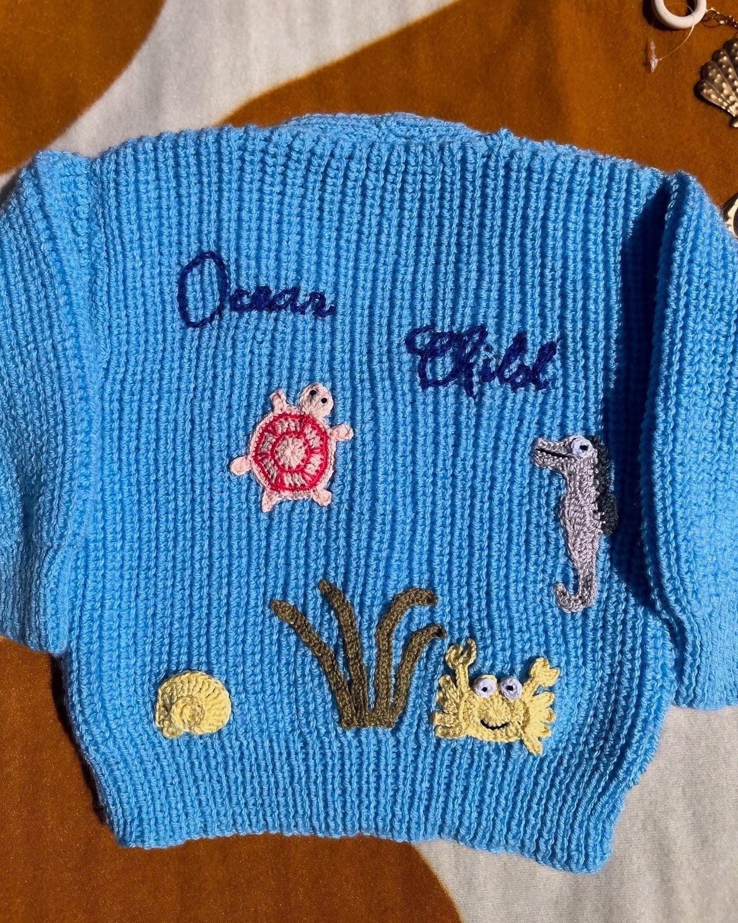 Handmade ocean theme baby knitwear UK blue knitted sweater with sea turtle crab and seahorse buttons