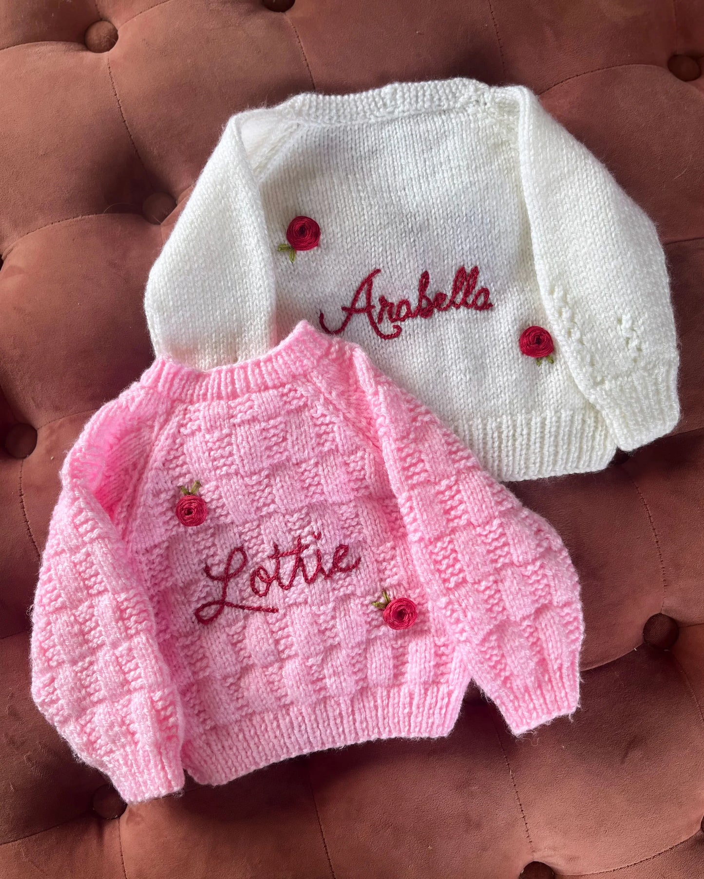 Personalised rose baby cardigan set in white and pink with embroidered names Arabella and Lottie by Little Flower Knits