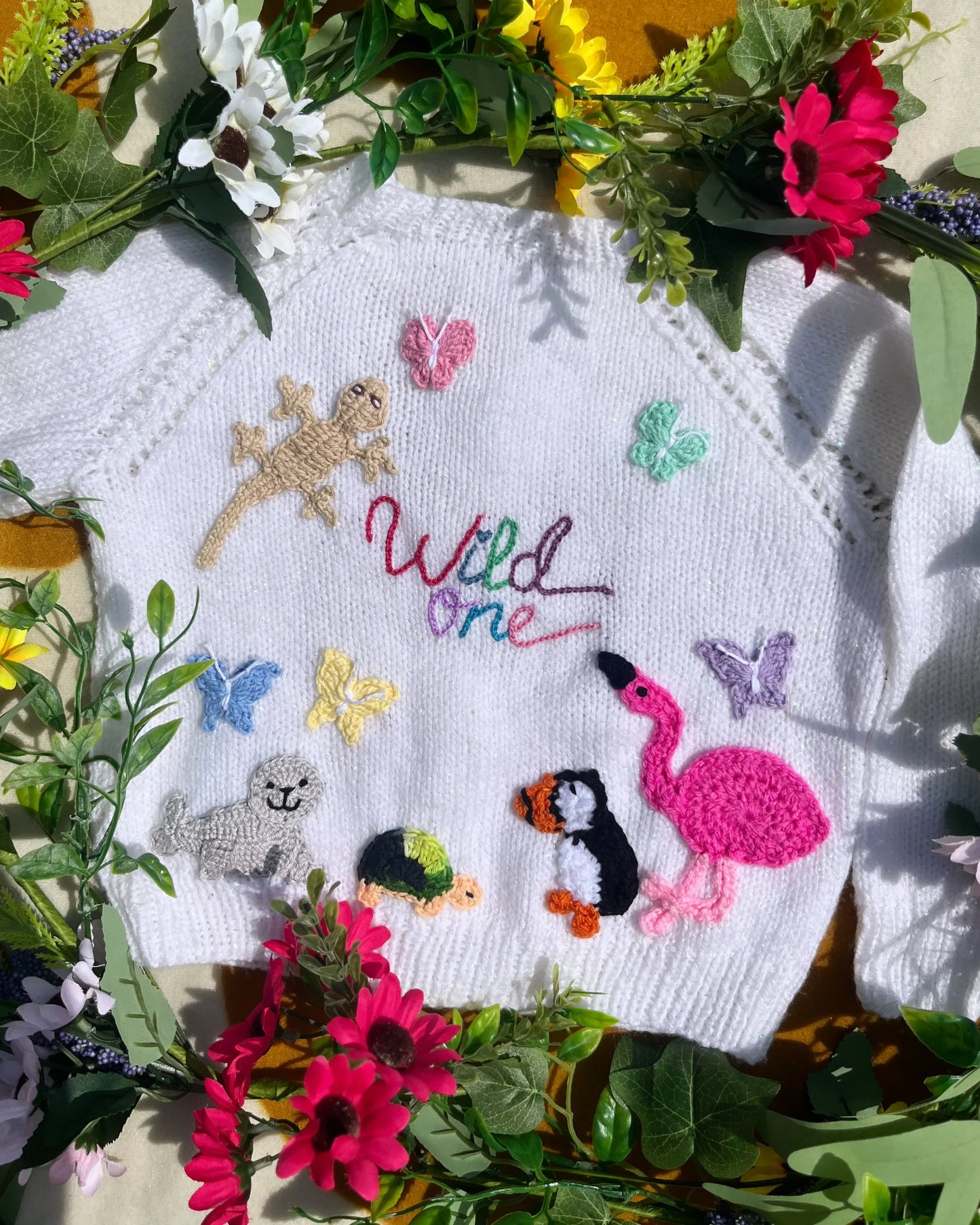 White knitted cardigan with animal and butterfly designs and Wild One text unique birthday gift for 1-5 year olds cardigan