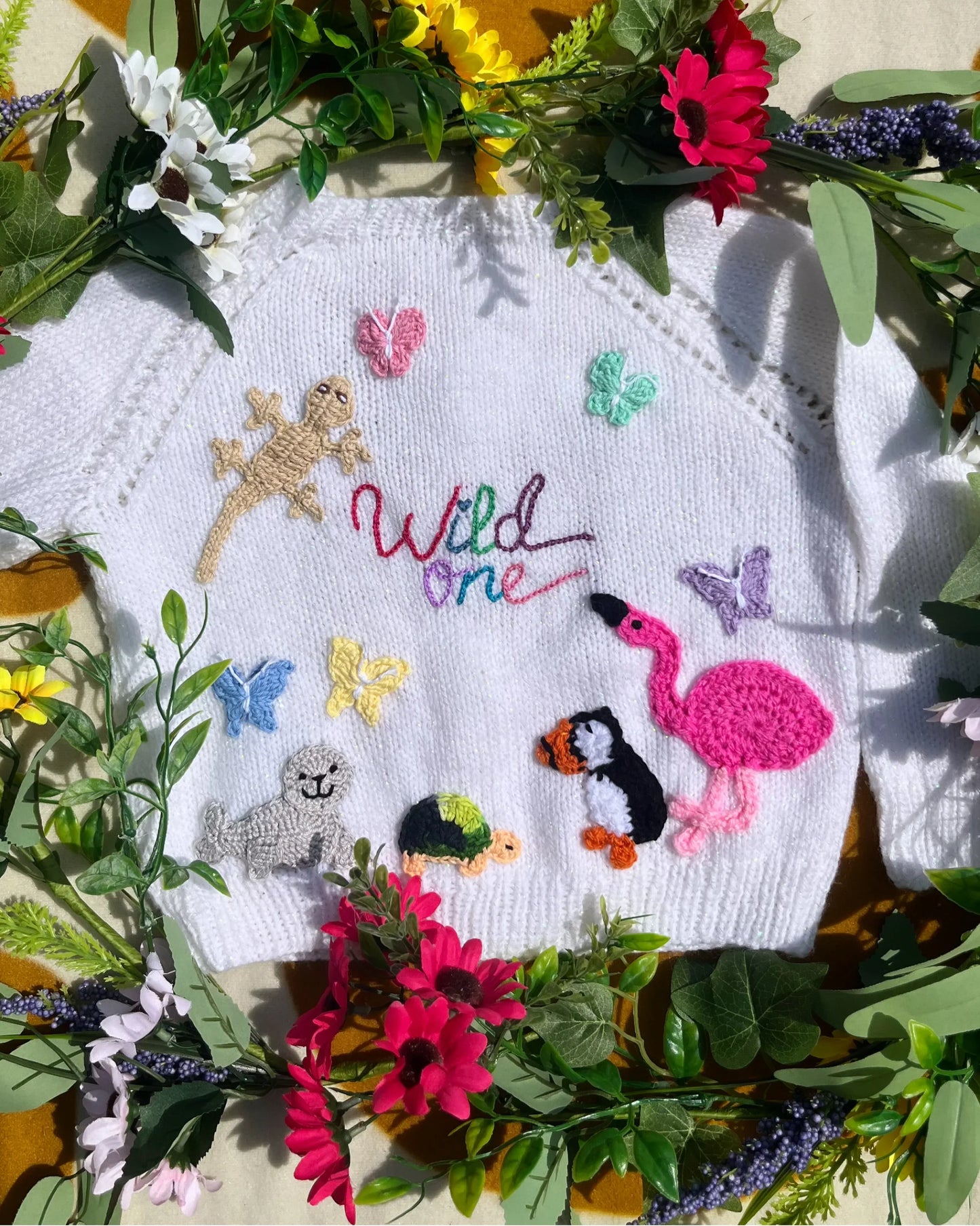 White knitted cardigan with colorful animal and butterfly appliques by Little Flower Knits unique birthday gift for 1-5 year olds cardigan