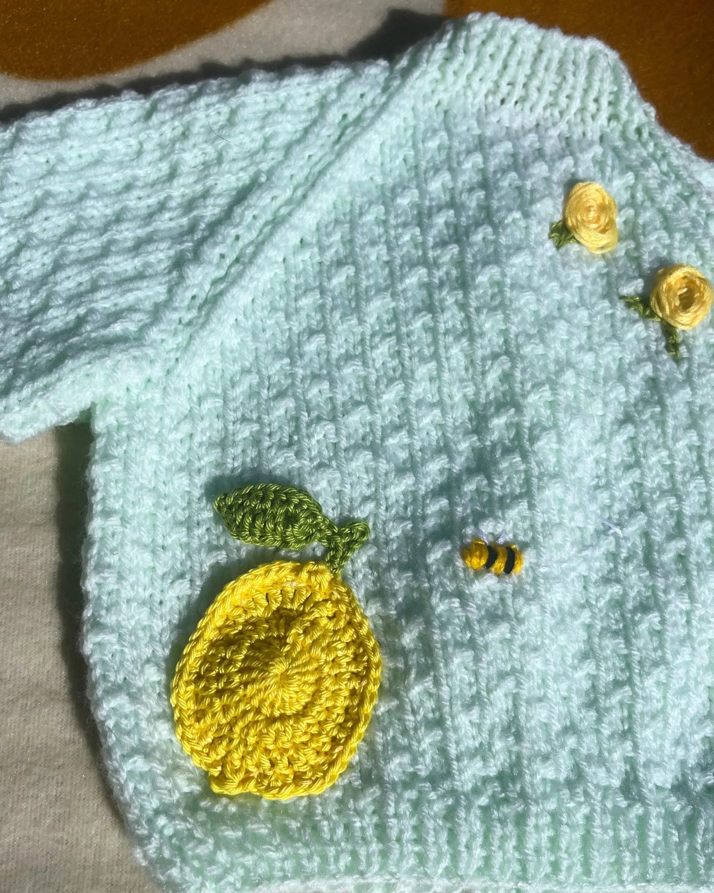 Lemon embroidery cardigan for babies with knitted yellow lemon and bee details by Little Flower Knits