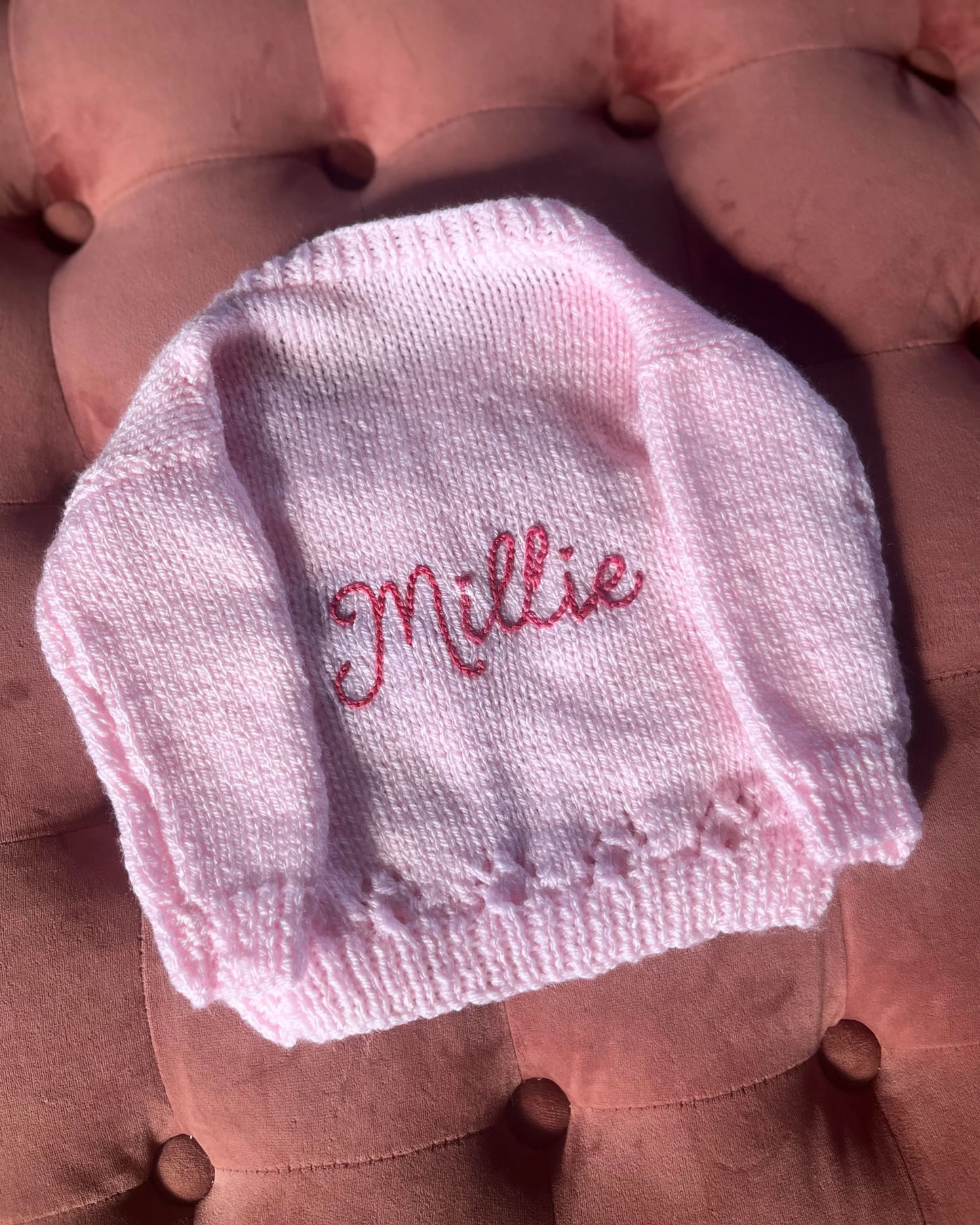 Little Flower Knits personalised baby cardigan UK featuring pink knitted fabric with Millie embroidery and decorative buttons