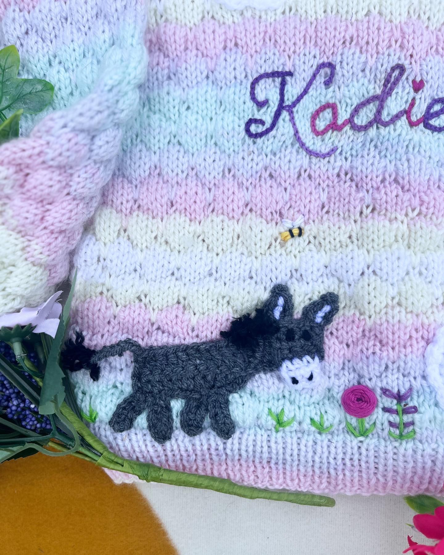 Personalised farm cardigan for toddlers with knitted name and donkey design by Little Flower Knits
