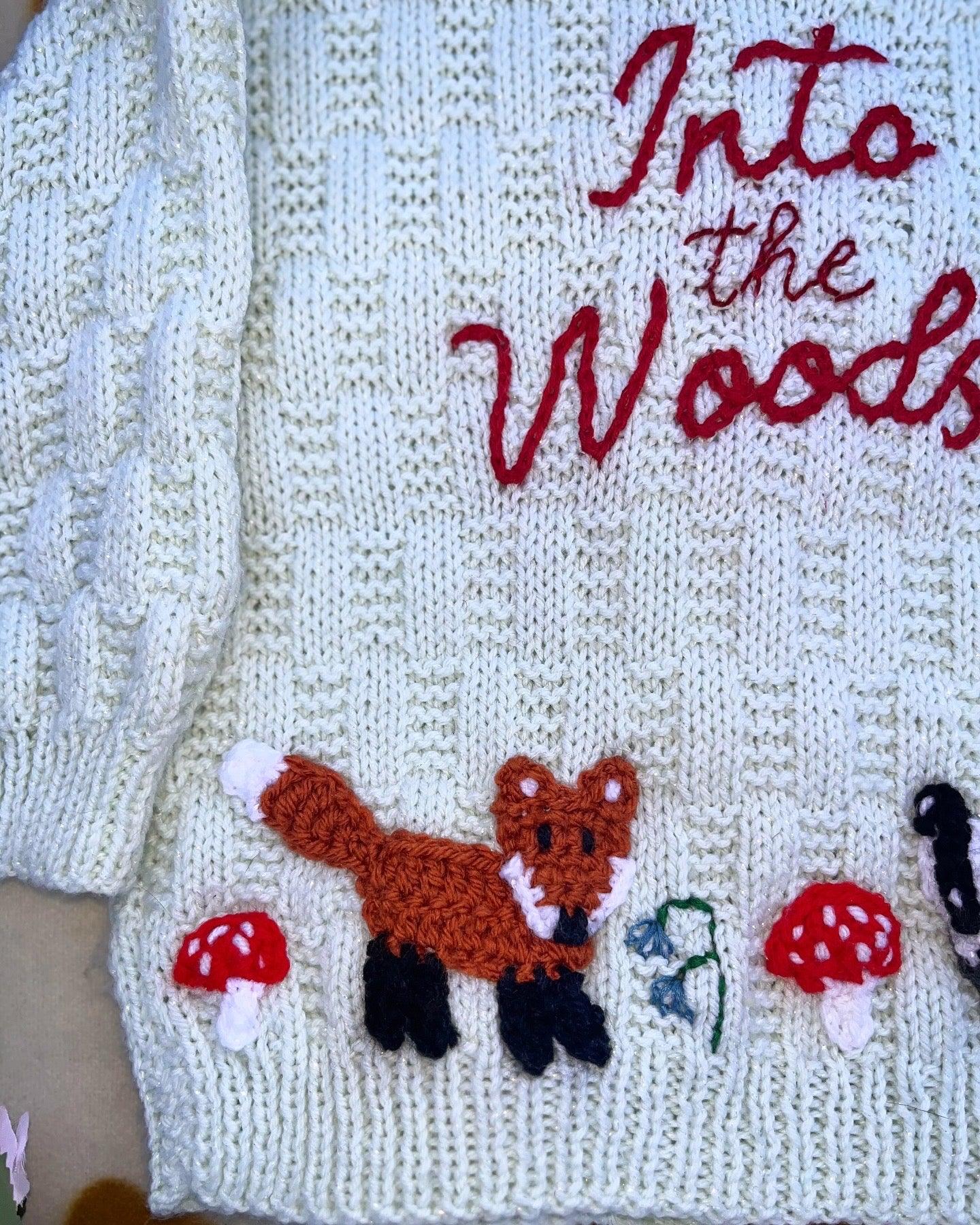 Personalised woodland cardigan for children with knitted fox, mushrooms, and Into the Woods embroidery
