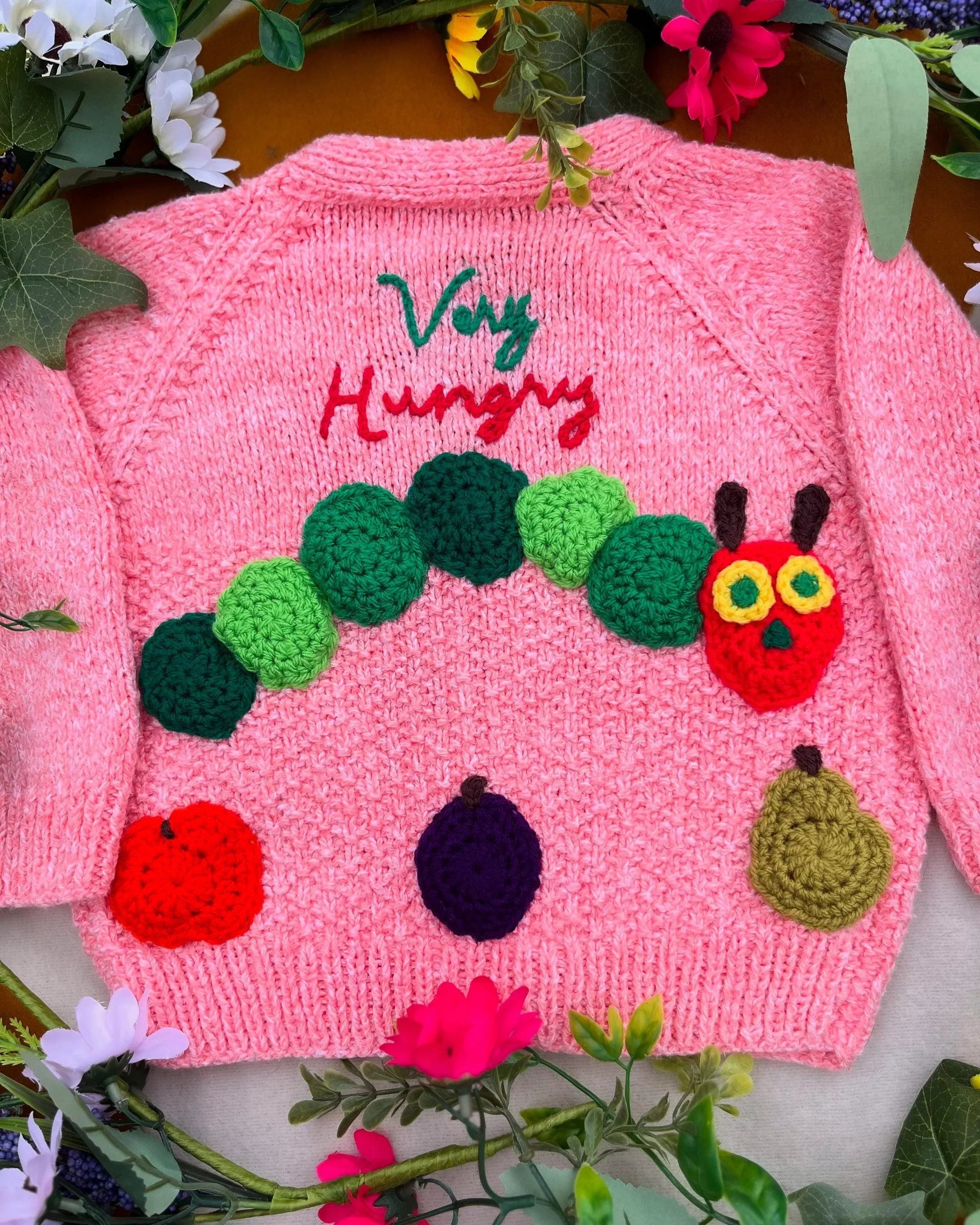 Unique animal design cardigan toddler with pink knit and colourful caterpillar and fruit buttons by Little Flower Knits