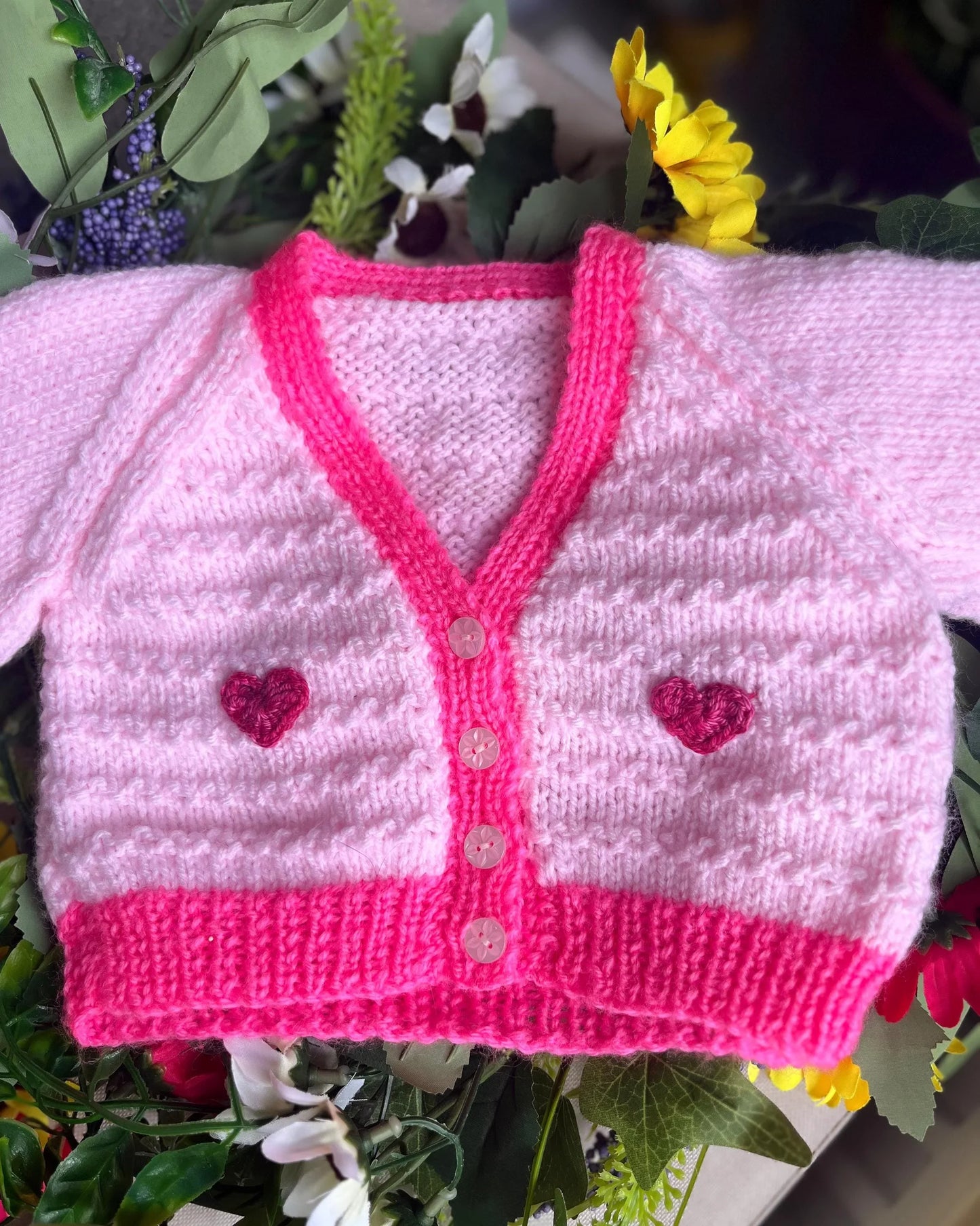 Little Flower Knits unique baby fish cardigan in pink with heart buttons and textured knit design