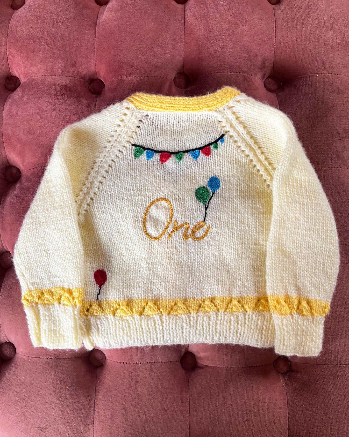 Hand knitted cream and yellow baby cardigan with balloons and One embroidery unique first birthday cardigan gift