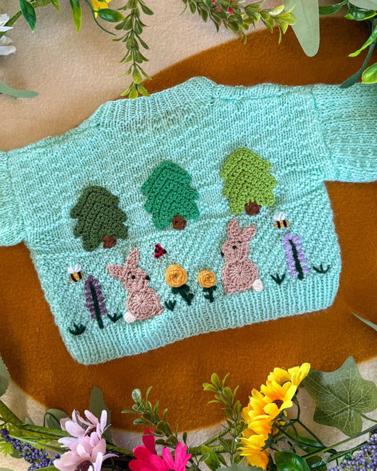 Wildflower meadow baby cardigan in mint green with embroidered bunnies and flowers