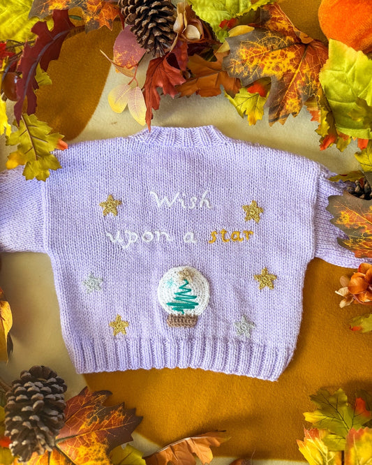Purple baby cardigan with embroidered design that says wish upon a star and a tree motif by Little Flower Knits