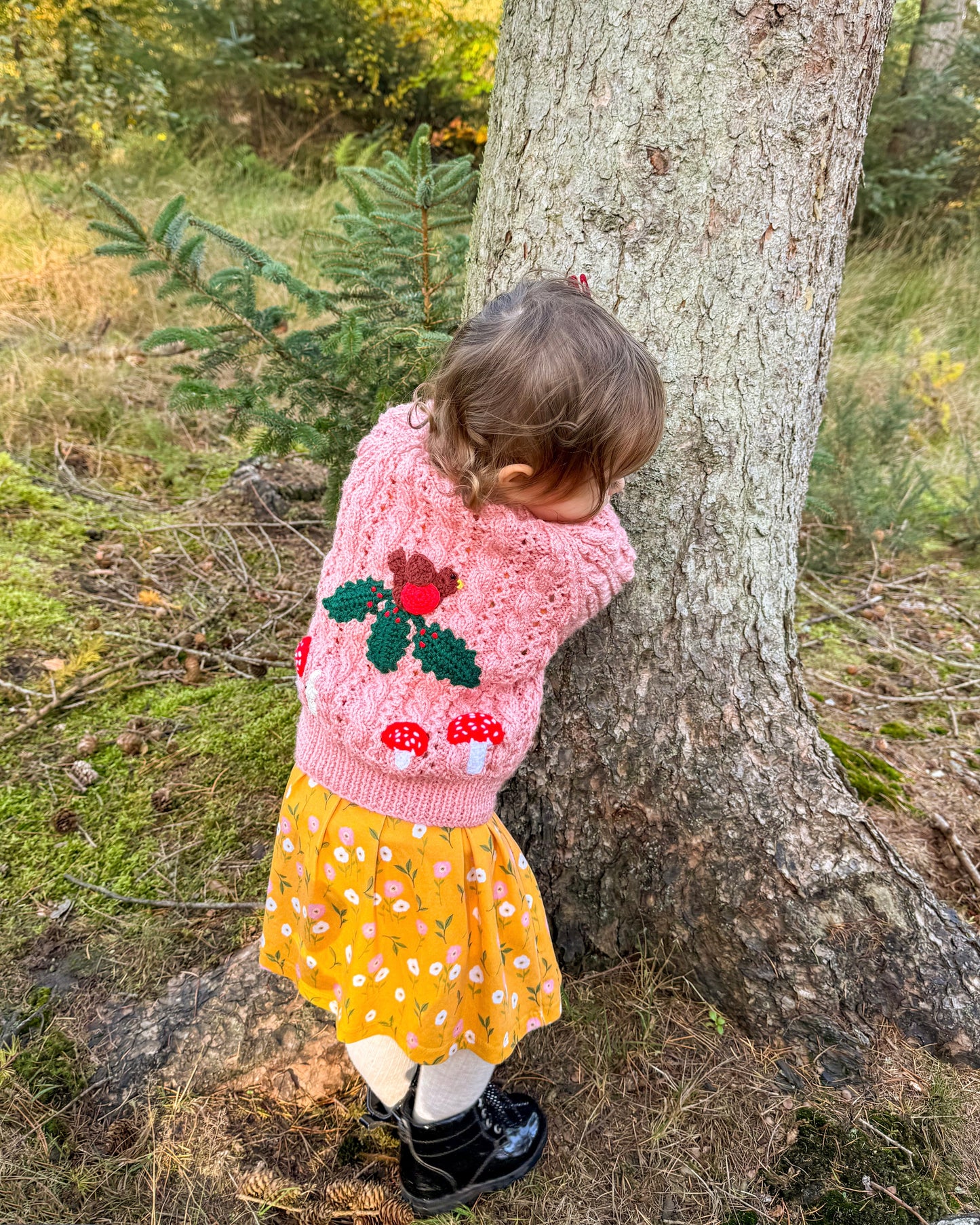 Adorable woodland themed kids cardigan in pink featuring mushroom designs, perfect for autumn outings