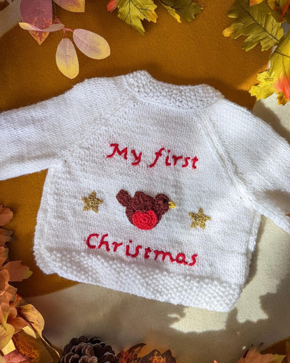 Little Flower Knits baby's first Christmas cardigan featuring a festive bird design and cheerful lettering