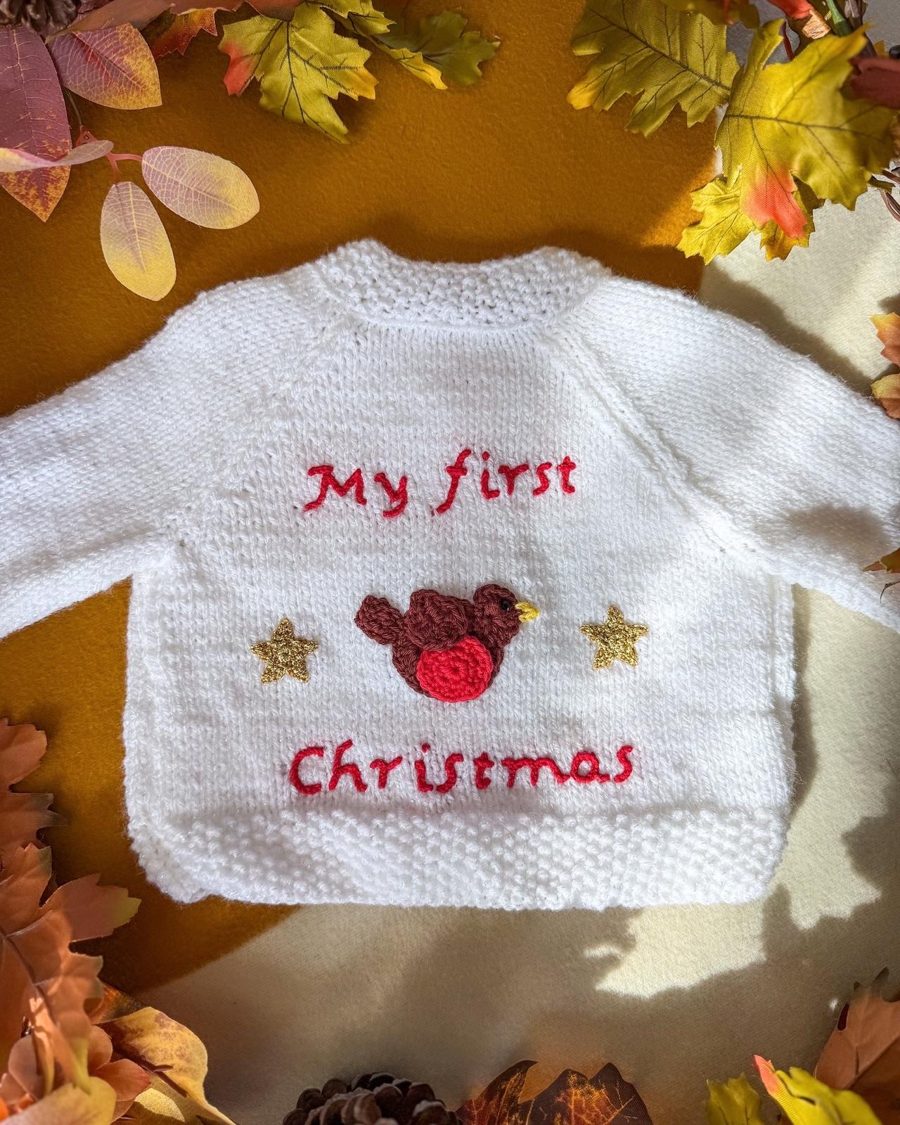 White baby's first Christmas cardigan with turkey design and festive embroidery