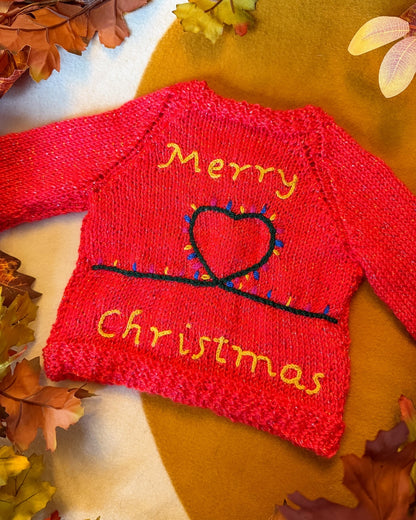 Bright red Christmas baby cardigan 3-6 months with festive 'Merry Christmas' and heart design