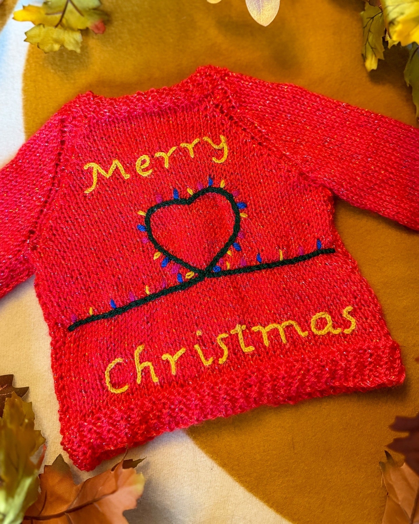 Bright red Christmas baby cardigan 3-6 months with festive embroidered design and colourful lights