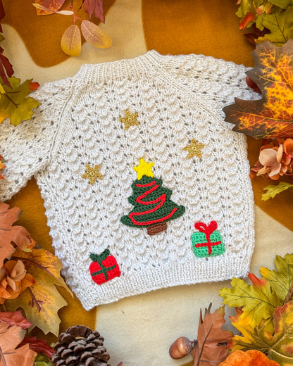Handcrafted Christmas tree cardigan baby with festive embroidery and decorative elements
