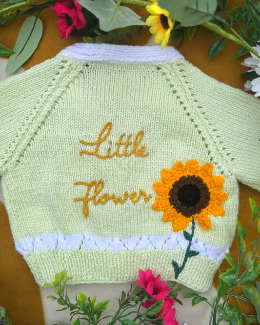 Personalised sunflower cardigan for kids in light green with yellow flower and name embroidery by Little Flower Knits