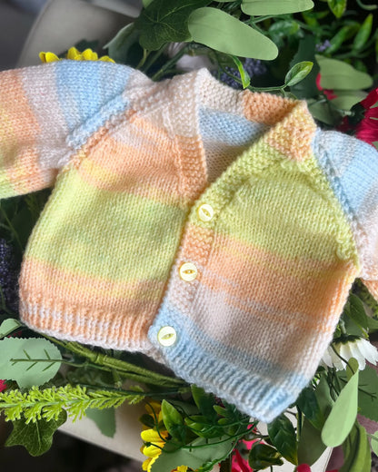 Eco-friendly baby girl cardigan gift with pastel stripes and Little Flower Knits initials buttons
