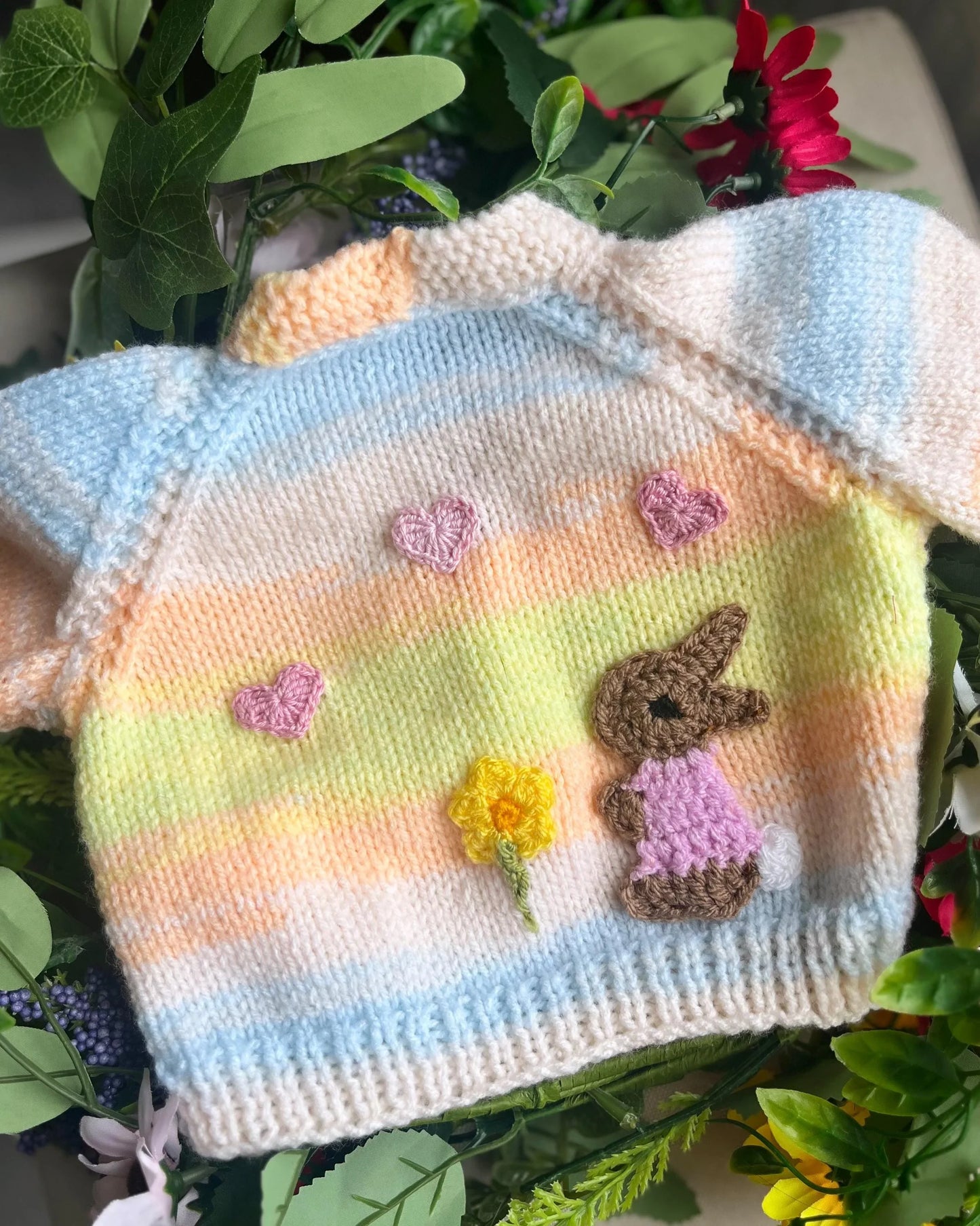 Eco-friendly baby girl cardigan gift with pastel rainbow knit and cute bunny and flower designs