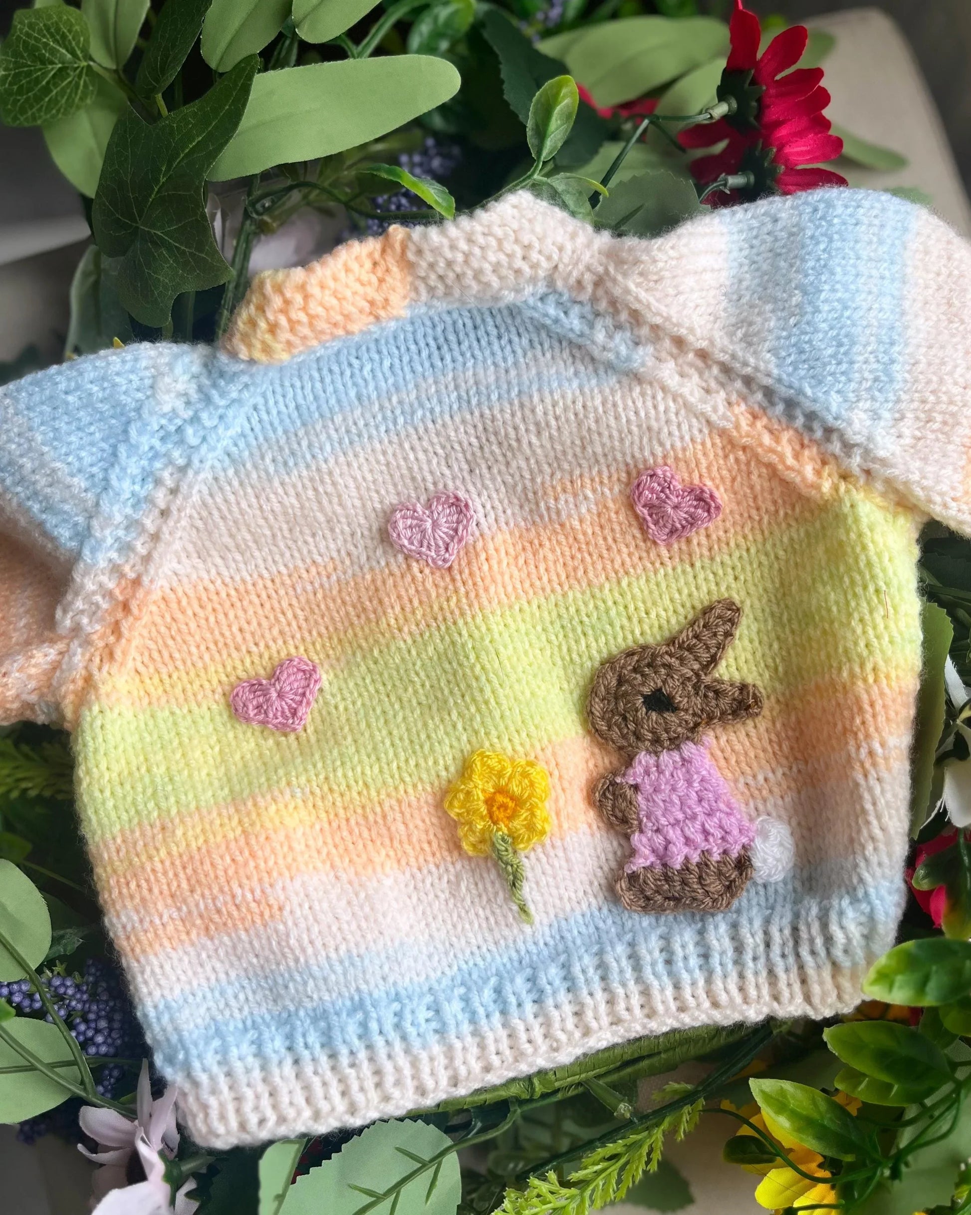 Eco-friendly baby girl cardigan gift with pastel rainbow knit and cute bunny and flower designs
