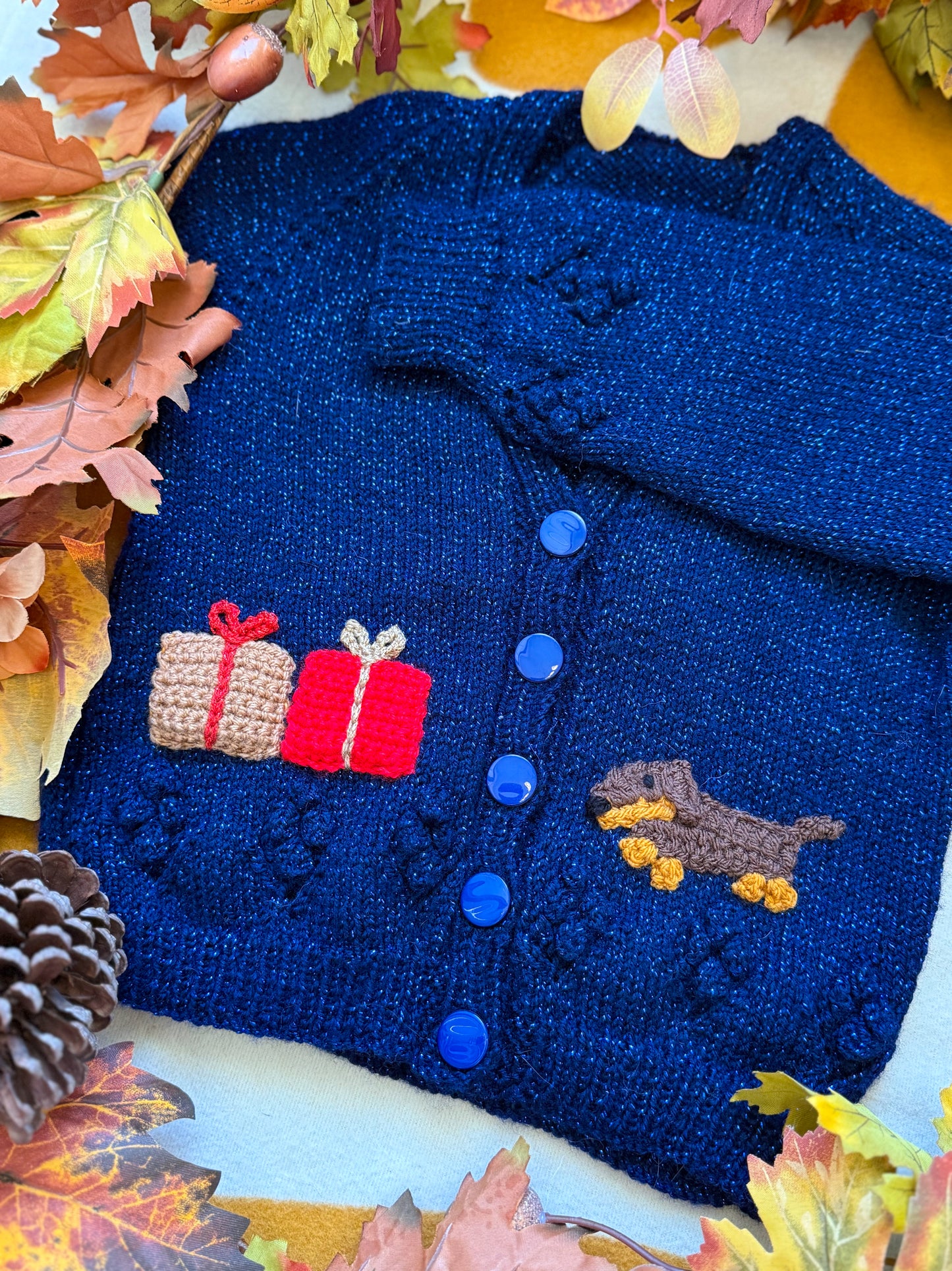Navy blue Grinchmas cardigan for toddlers with colourful gift and dachshund designs