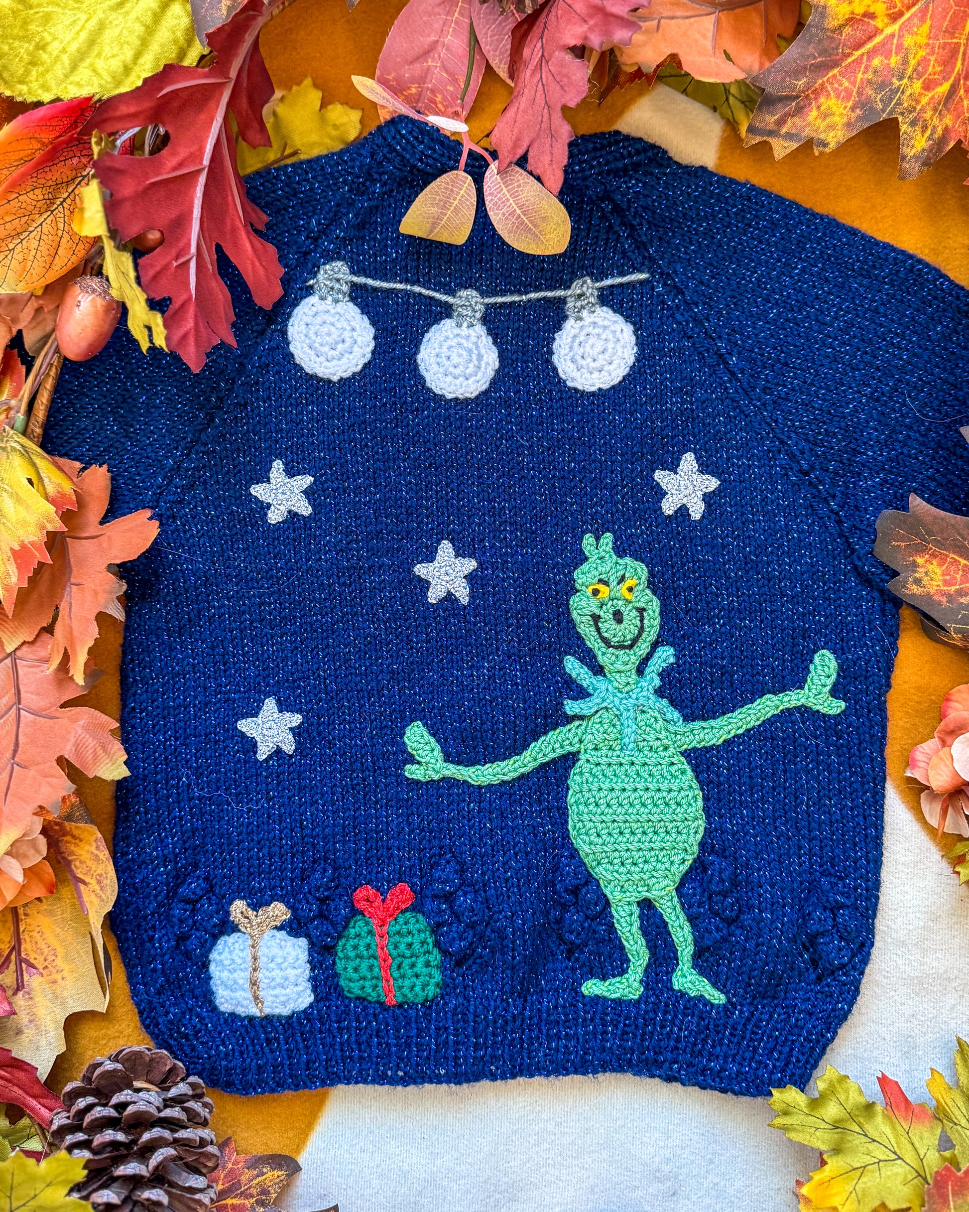 Navy Grinchmas cardigan for toddlers with fun Grinch design and festive decorations