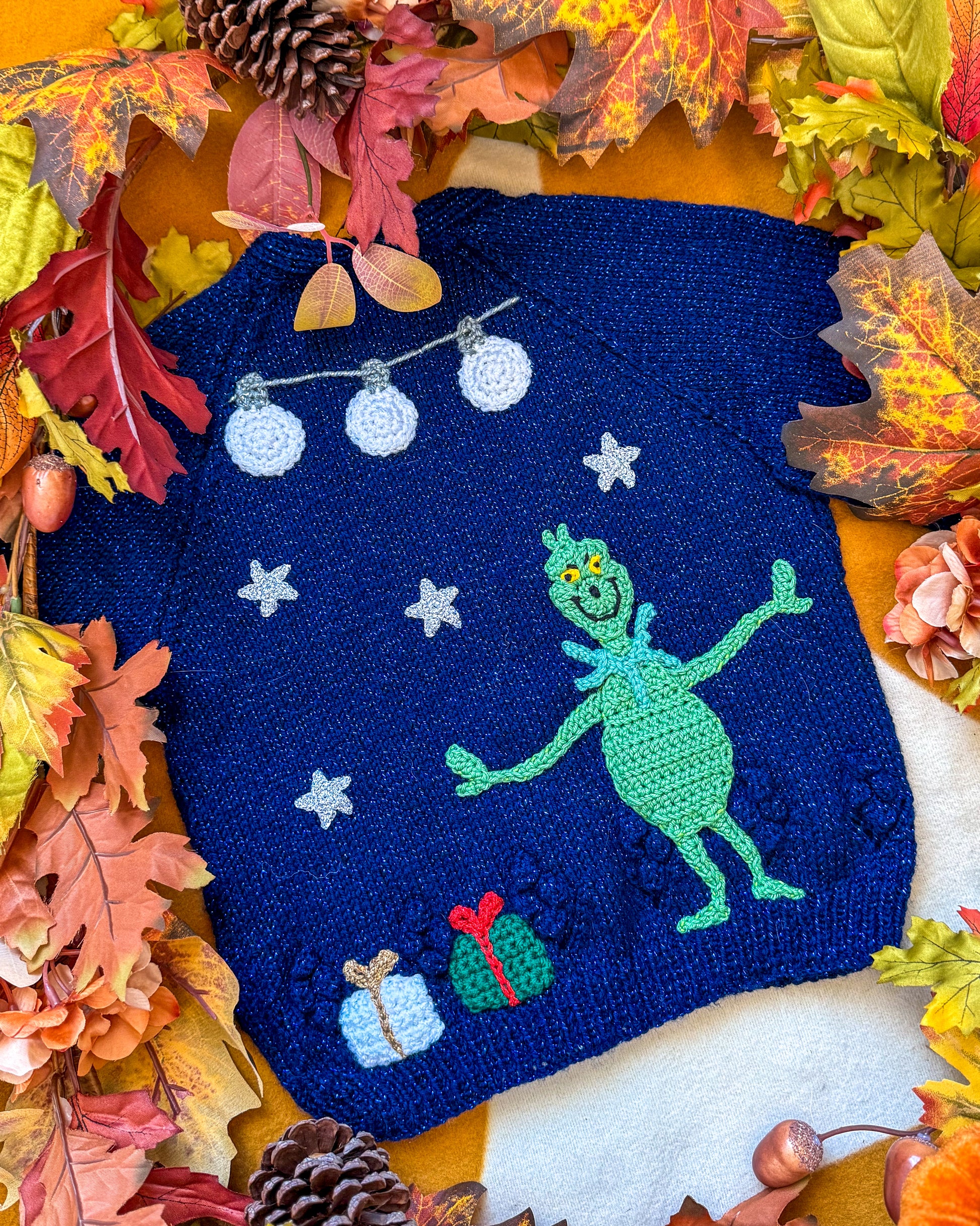 Little Flower Knits Grinchmas cardigan for toddlers with festive crochet design and winter decorations