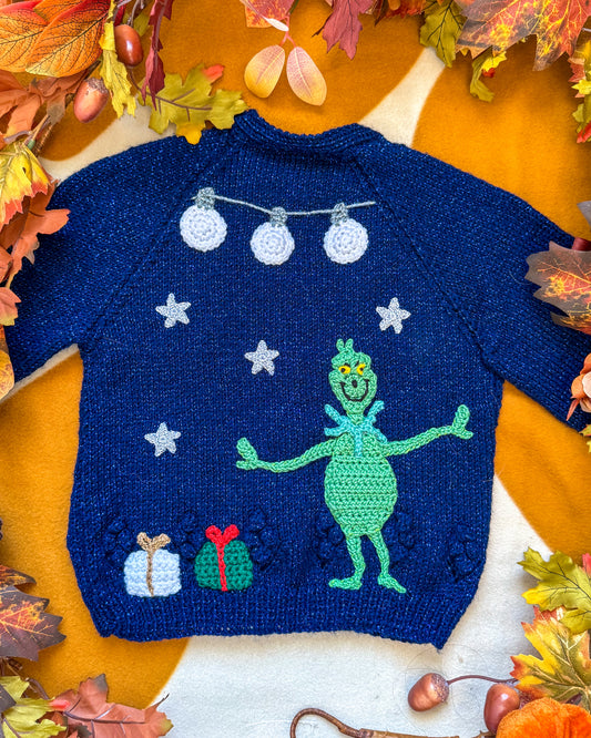 Navy Grinchmas cardigan for toddlers featuring a crochet Grinch and festive decorations