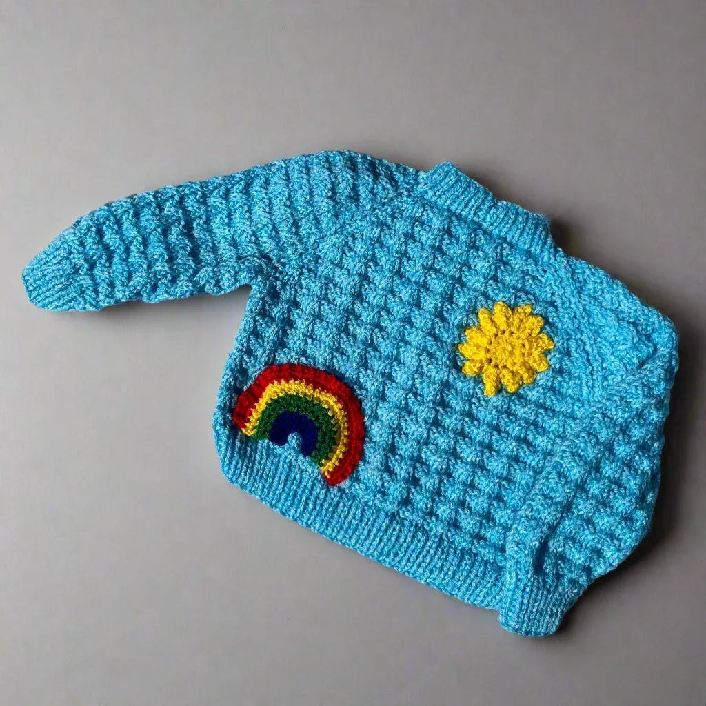 Blue newborn cardigan with rainbow and yellow flower knitted by Little Flower Knits