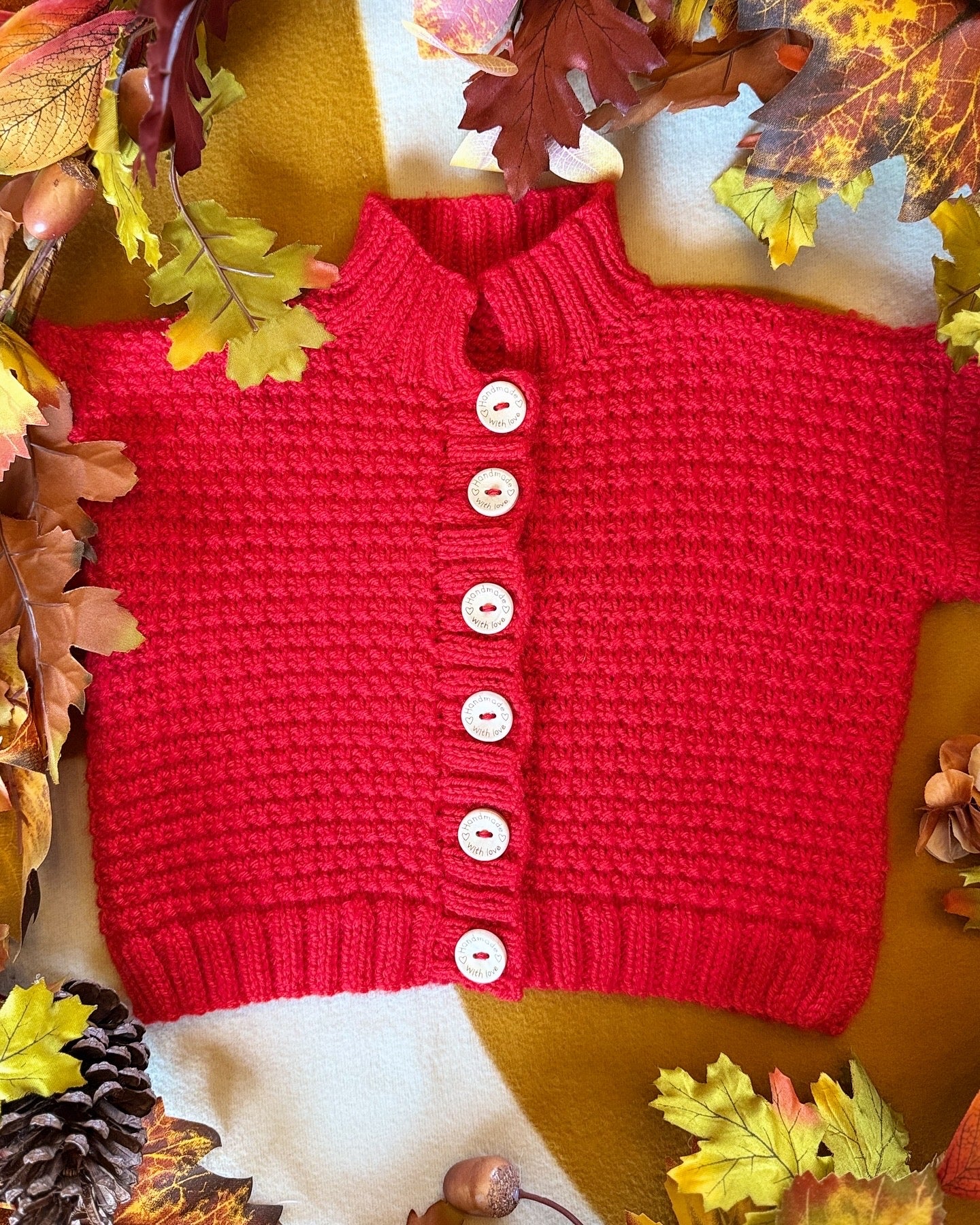 Handmade Christmas cardigan 12-18 months in vibrant red with button front and textured knit design