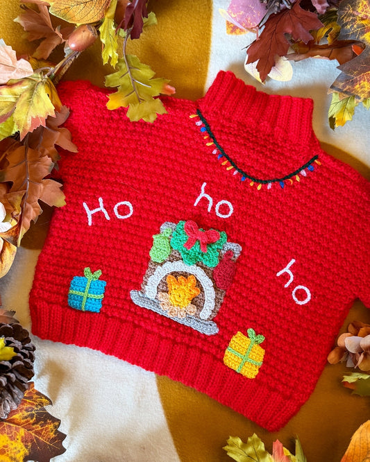 Little Flower Knits handmade Christmas cardigan 12-18 months in red with festive fireplace design