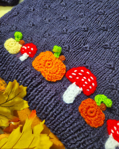 Little Flower Knits navy knitted fabric with crocheted pumpkins and red toadstools for hand-knitted pumpkin and toadstool costume
