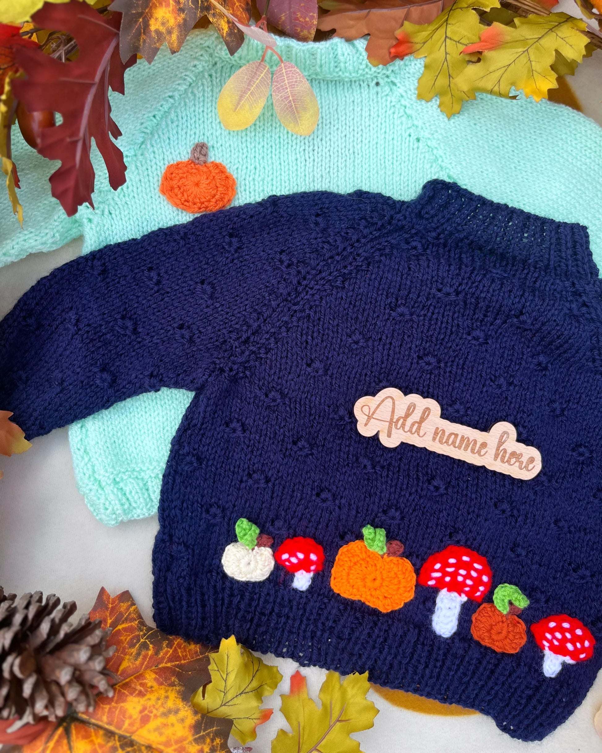 Navy and mint infant sweaters with autumn pumpkin and toadstool appliques hand-knitted pumpkin and toadstool costume