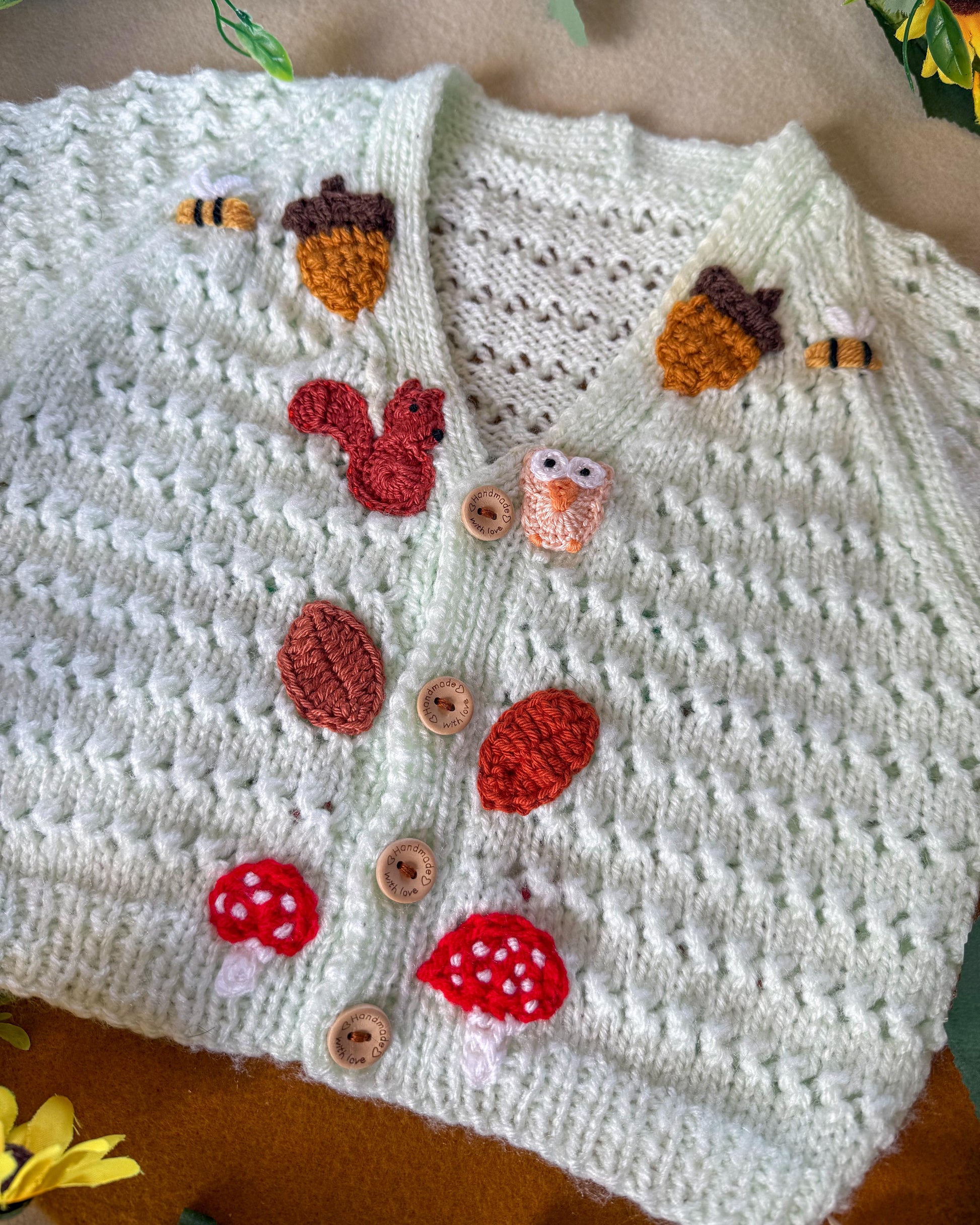 Handmade baby cardigan 9-12 months featuring adorable nature-inspired appliqués and wooden buttons