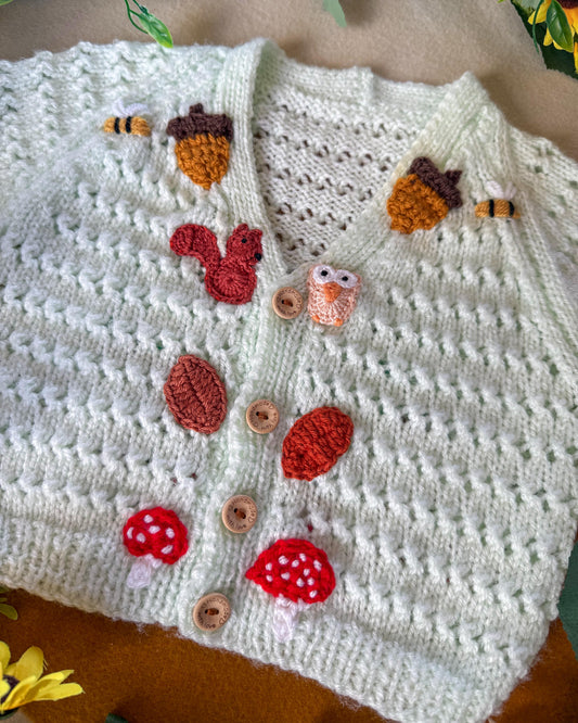 Handmade baby cardigan 9-12 months featuring adorable nature-inspired appliqués and wooden buttons