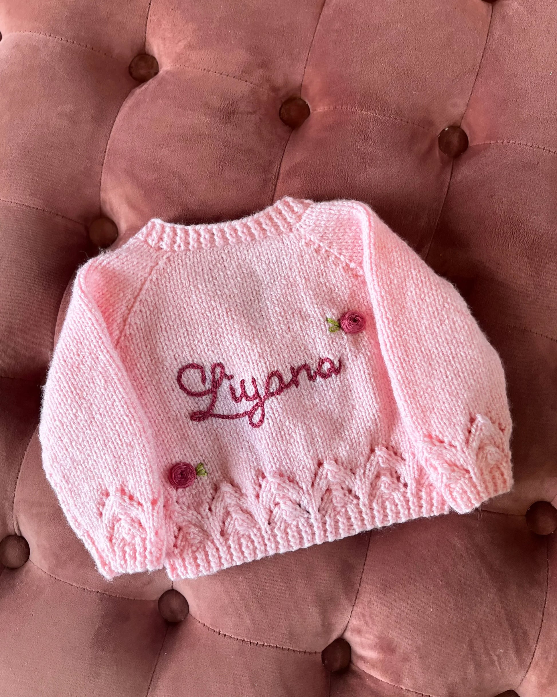 Little Flower Knits personalised rose baby cardigan in soft pink with delicate rose embroidery and custom name