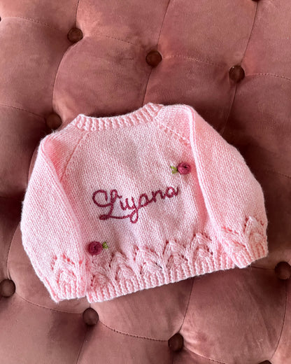 Little Flower Knits personalised rose baby cardigan in soft pink with delicate rose embroidery and custom name