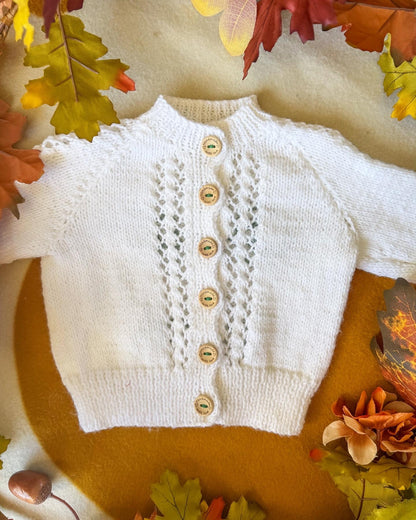 Little Flower Knits White Knitted Baby Cardigan with Lace Detail and Wooden Buttons