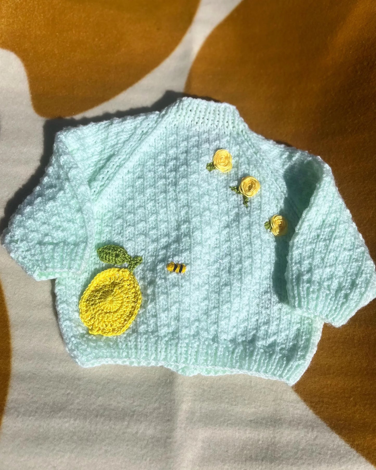 Hand knitted lemon embroidery cardigan for babies in light blue with yellow lemon and buttons by Little Flower Knits