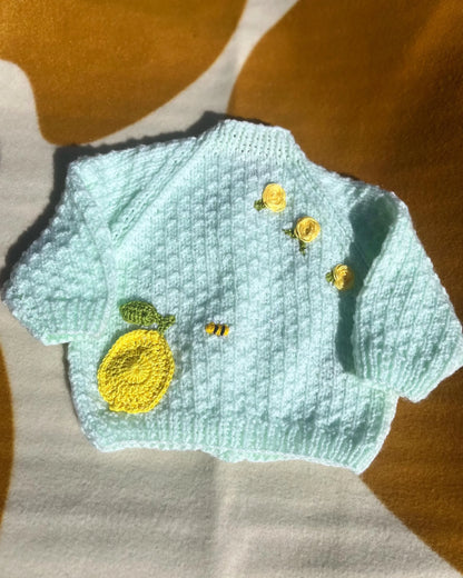 Hand knitted lemon embroidery cardigan for babies in light blue with yellow lemon and buttons by Little Flower Knits
