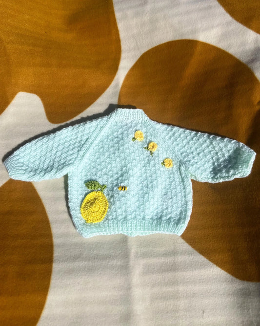 Lemon embroidery cardigan for babies by Little Flower Knits with yellow lemon and flower details