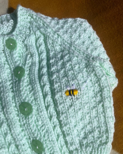 Green knitted lemon embroidery cardigan for babies featuring initial and button details by Little Flower Knits