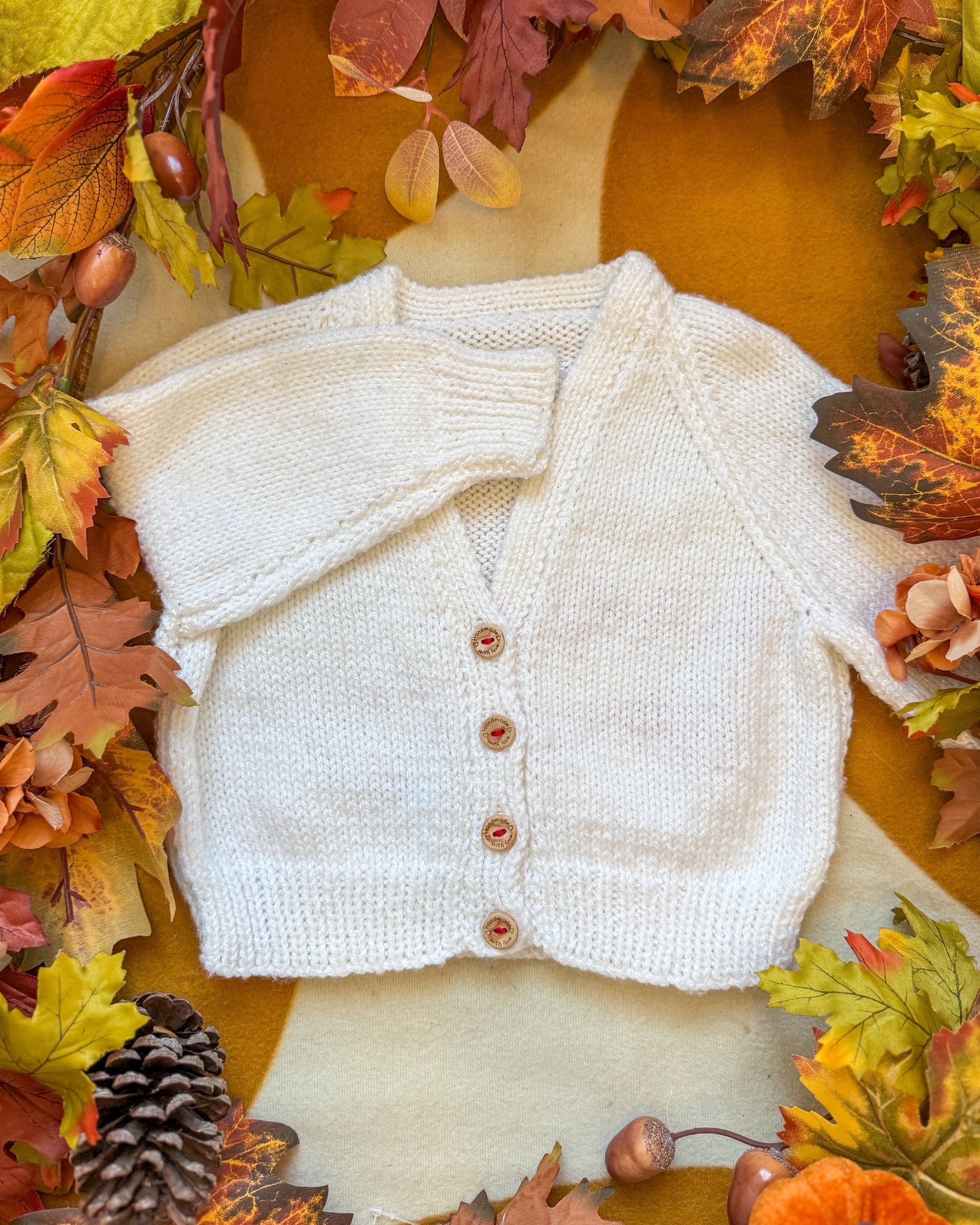 Little Flower Knits North Pole delivery cardigan 12-18 months in cream with wooden buttons and a soft texture