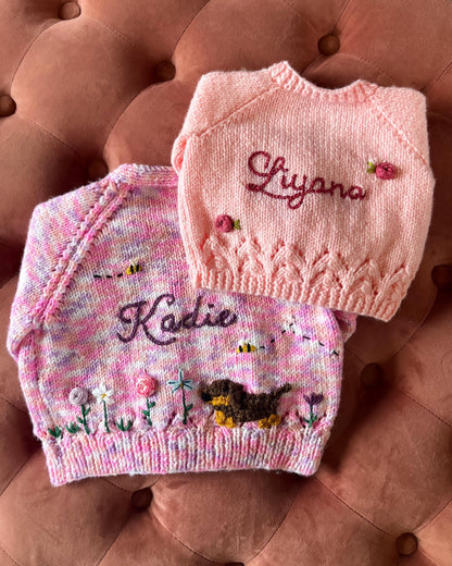 Personalised baby cardigan UK by Little Flower Knits with embroidered names and decorative buttons