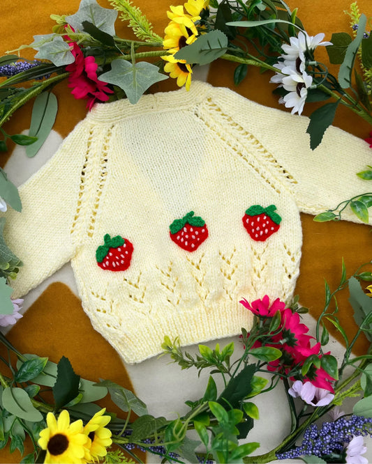 Little Flower Knits personalised baby strawberry cardigan in cream with red strawberry add ons and buttons