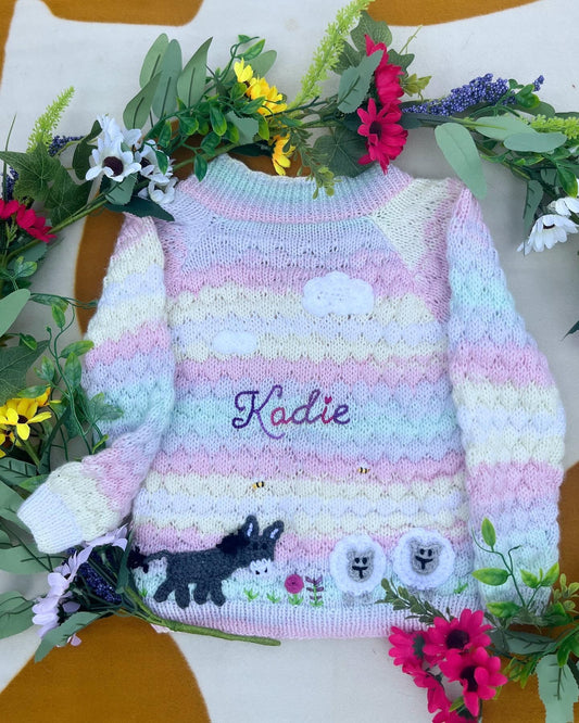 Personalised farm cardigan for toddlers with pastel stripes, embroidered name Kadie and farm animal buttons by Little Flower Knits