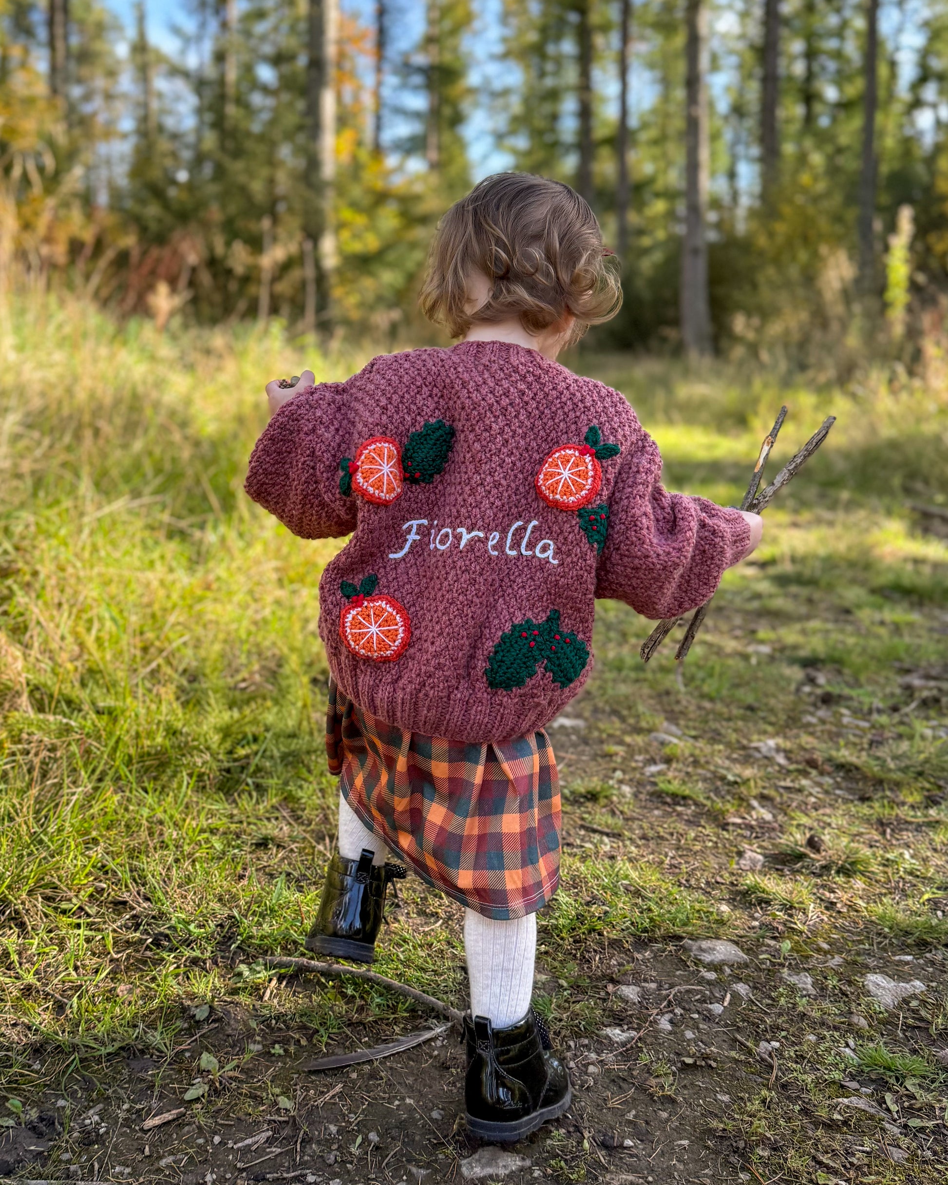 Little Flower Knits personalised kids cardigan hand knitted with orange designs for fashionable children