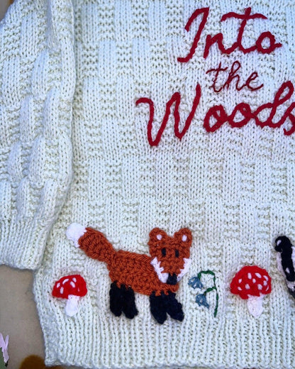 Personalised woodland cardigan for children with knitted fox, mushrooms, and Into the Woods embroidery