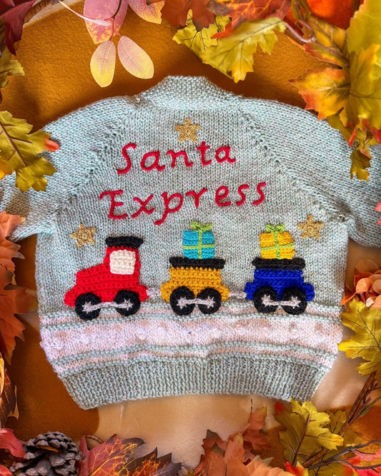 Santa Express baby cardigan in light blue with train design and holiday decorations