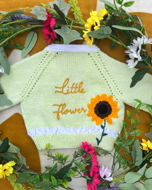 Little Flower Knits personalised sunflower cardigan for kids in light green with embroidered sunflower and text