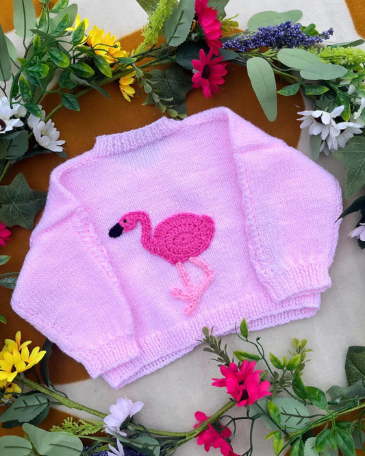 Little Flower Knits sustainable baby gift flamingo cardigan in soft pink with knitted flamingo design